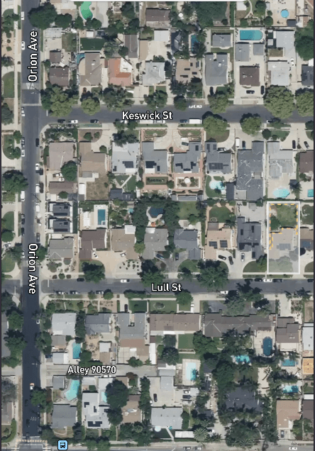 Satellite view of a residential street and lots